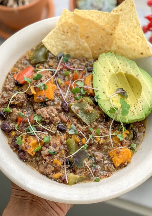 Bowl of chili with avocado and chips